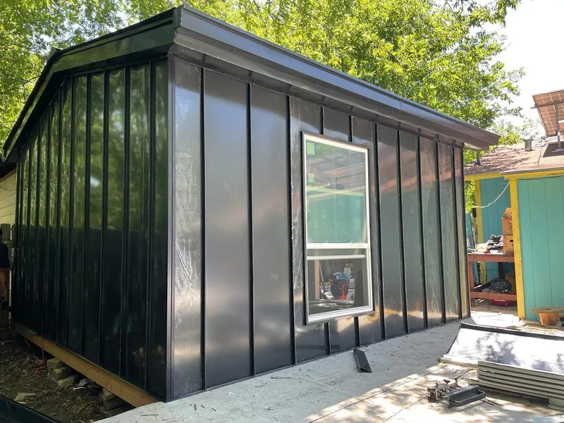 Black standing seam metal wall panels for Roof Inspection in Ogden